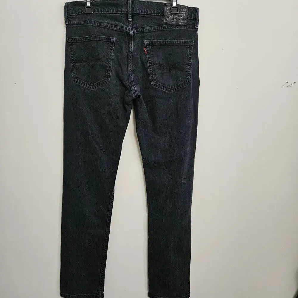 Levi's Men's Regular Fit Jean, 33Wx32L measures 31.5 Black VGUC